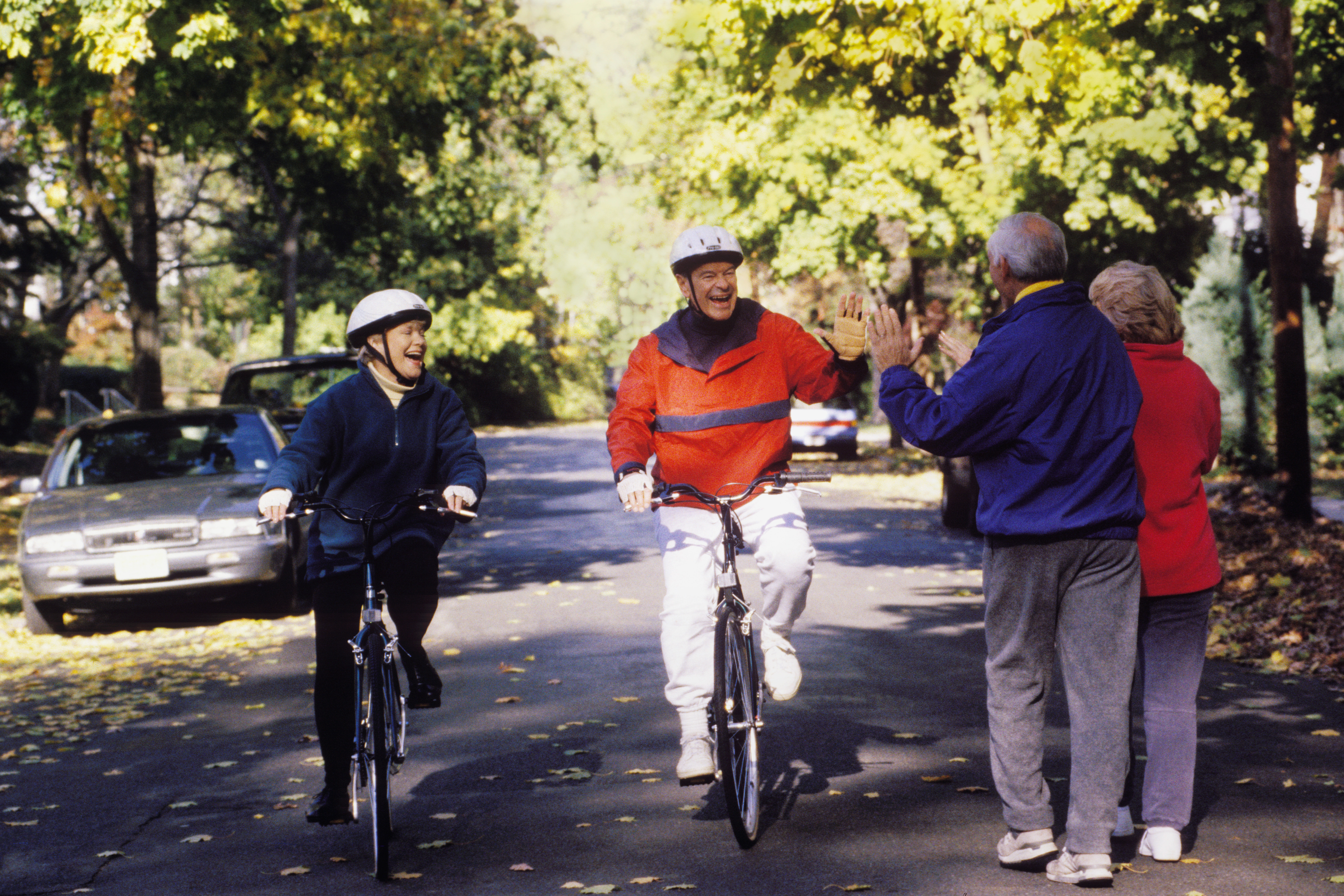 caucasian senior couples outdoors, walking and biking